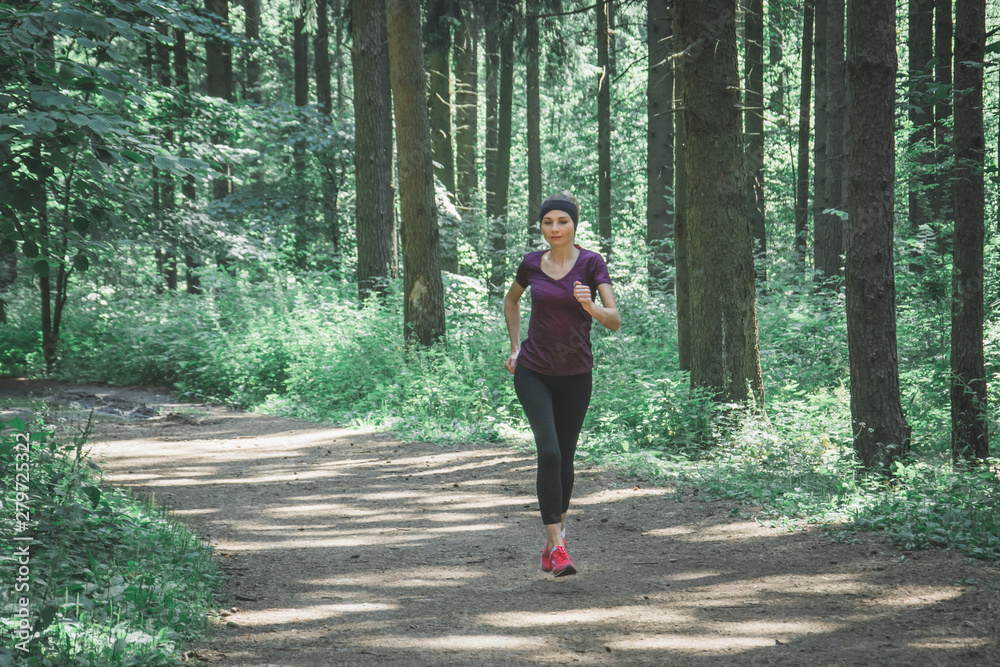 young fitness woman running cross country young fitness woman running cross country