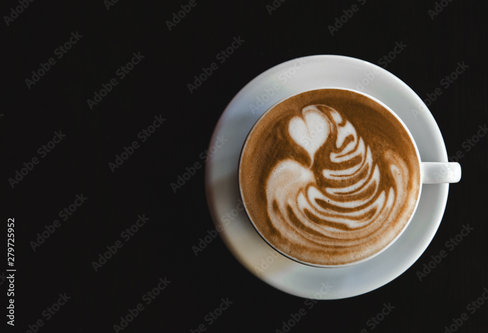 Cup of latte on black background. Photo made in dark key. Cup of latte on black background. Photo made in dark key.