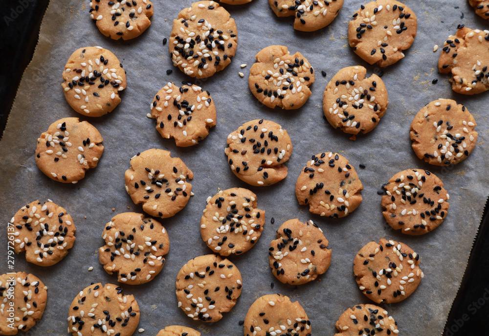 Sesame cookies on baking tray Sesame cookies on baking tray