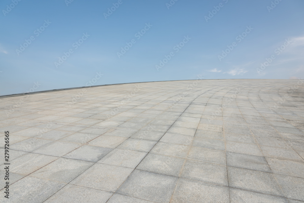 Curved marble tile platform and sky view at the top of the city's tall buildings