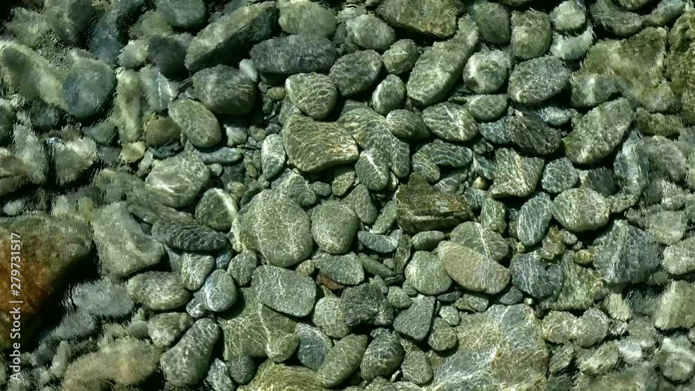Stones and pebbles shallow water reflections Stones and pebbles shallow water reflections