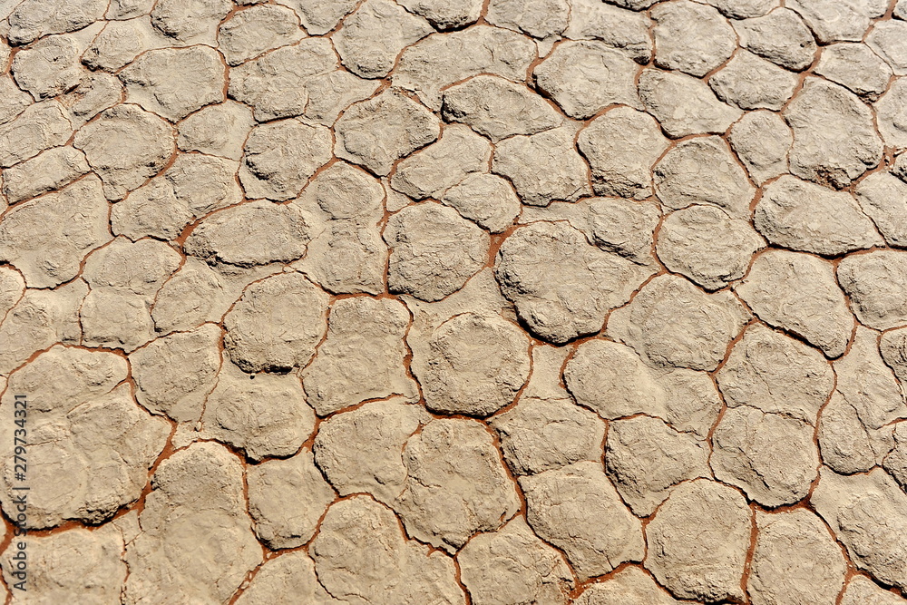 Cracked clay soil with a texture of yellow red blocks with red veins. Africa. Namib Desert . Cracked clay soil with a texture of yellow red blocks with red veins. Africa. Namib Desert .