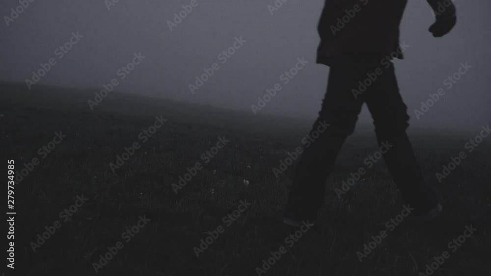 Silhouette in abandoned icelandic canyon in a foggy, moody, dramatic landscape. SlowMo and regulari speed of man's silhouette exploring the area. Shot on the Sony a7iii and Ronin S.
