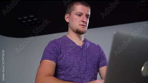 Caucasian Man Getting Angry at Computer As He Works photo