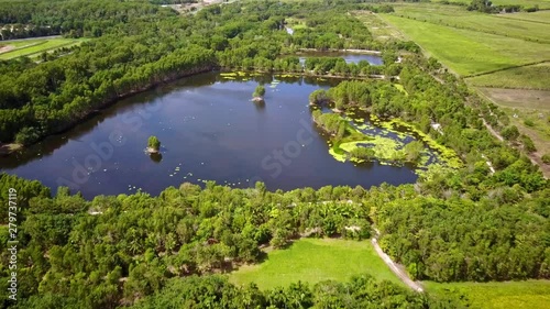 Backwards aerial footage of the Cattana Wetlands at Smithfield, near Cairns, Queensland, Australia. August 2018. photo