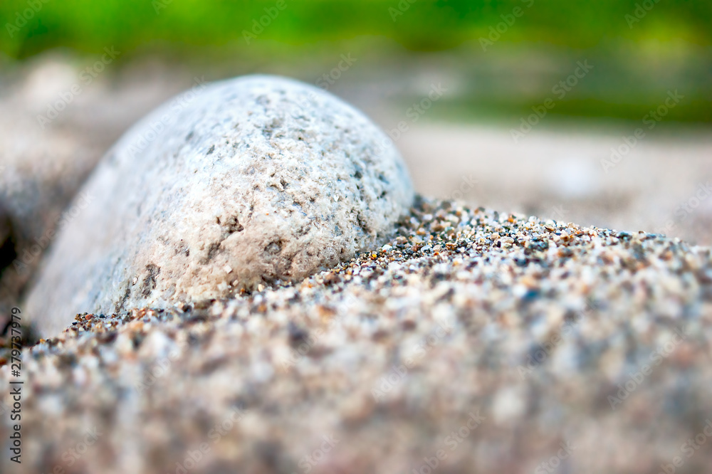 Close-up View of White Cobble in Coarse Sand. Travel Concept. Close-up View of White Cobble in Coarse Sand. Travel Concept.