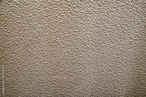 Embossed grungy painted wall texture as background