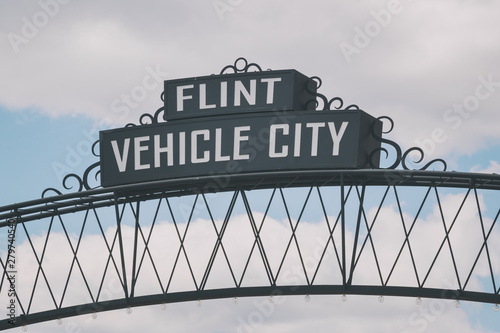 Flint, Michigan downtown gateway sign showing Vehicle City. Known widely for their water quality and safety issues. photo