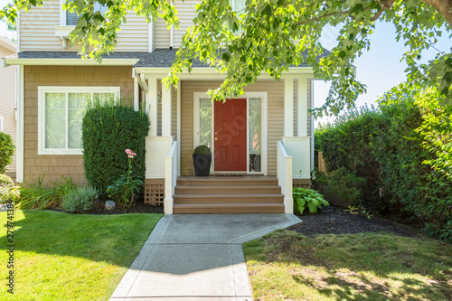 Quadro su tela Door steps and concrete pathway leading to residential house main entrance