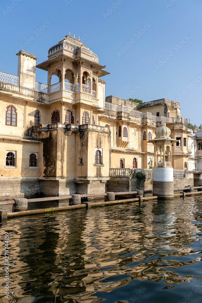 Architecture, decorated facade near water lake in Udaipur, Rajasthan, India