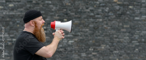 Man with a grievance yelling into a megaphone photo