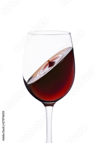 splash of red wine in glass isolated on white background.