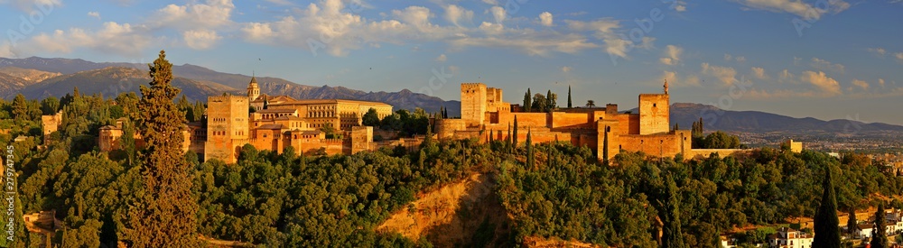 Panoramic view of Alhambra palace in the blue hours, Granada - Andalusia, Spain, viewed from Mirador San Nicolas. 