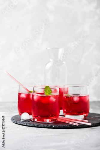 Red alcoholic coctail with ice and mint