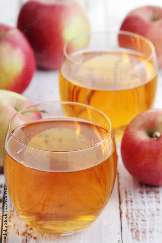 Two glasses with apple juice Two glasses with apple juice