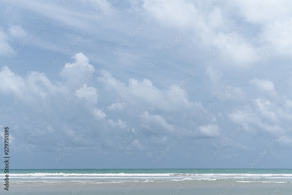 Cloudy sky in middle of the day with  blue sea and white wave in the picture /background texture / blue sky / high resolution