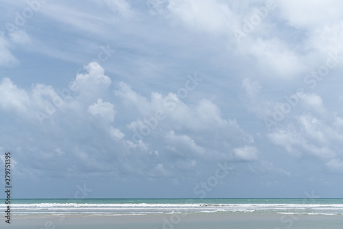 Cloudy sky in middle of the day with blue sea and white wave in the picture /background texture / blue sky / high resolution
