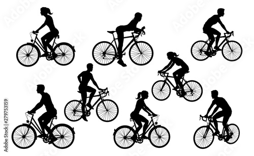 A set of bicycle cyclists riding their bikes in silhouette