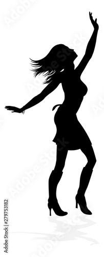 A young woman in silhouette dancing like at a night club or other event