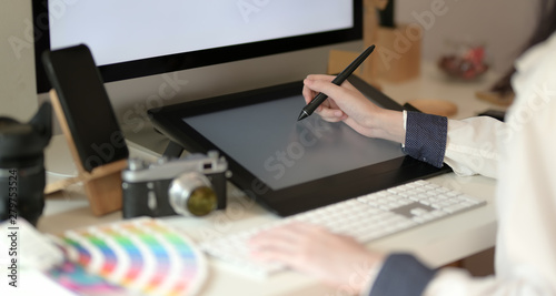 Young graphic designer drawing photo