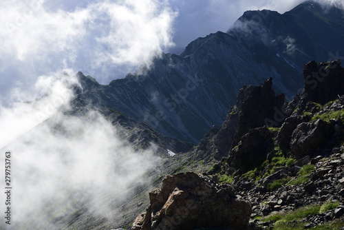 Clouds approaching the mountain ridge,The ridge "Nishi-Kamaone" of Mt. Yarigatake, Japan Alps