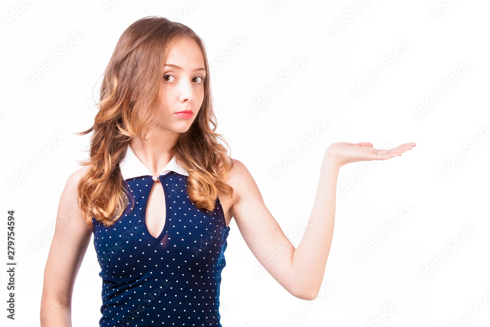 Attractive girl holds hand palm up on white background.