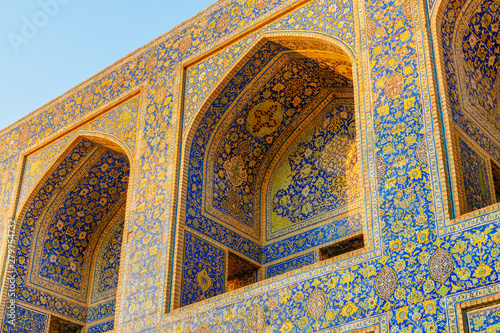 Arch niches covered with colorful mosaic tiles, the Shah Mosque