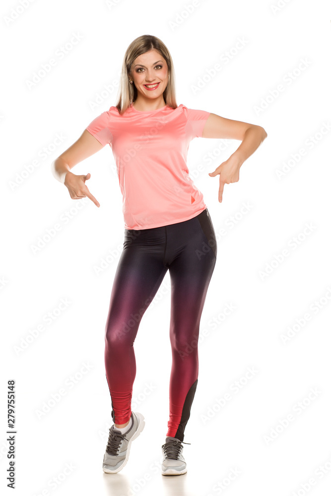 Young sporty woman posing on white background Young sporty woman posing on white background