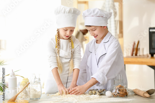 Cute little chefs cooking i...