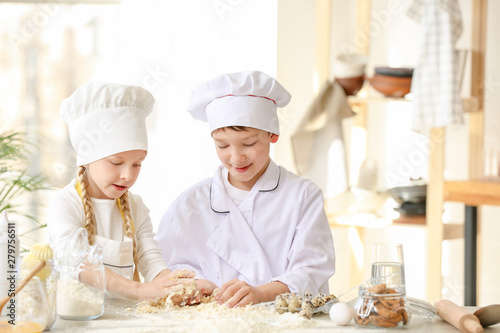 Cute little chefs cooking i...