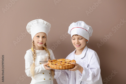 Cute little chefs with pie ...