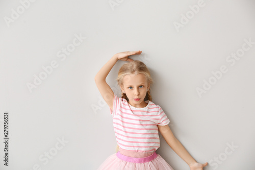 Cute little girl measuring ...