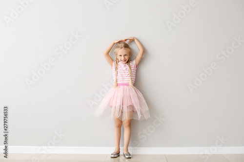 Cute little girl measuring ...
