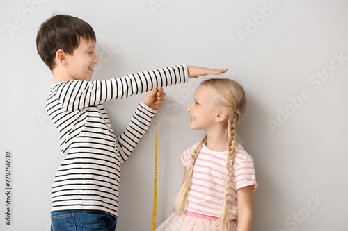 Cute little children measur...