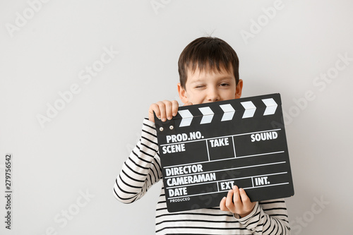 Little boy with clapperboar...