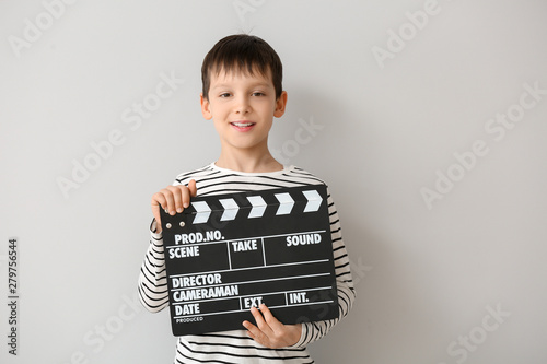 Little boy with clapperboar...