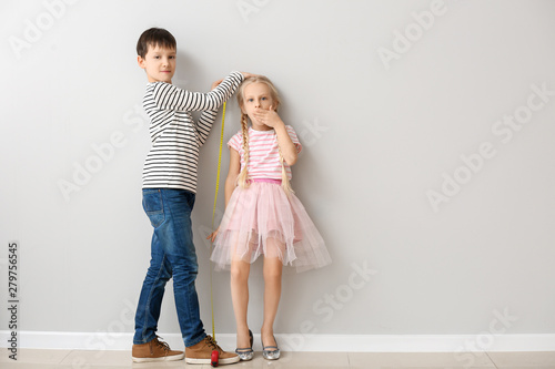 Cute little children measur...