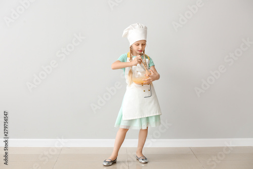 Cute little chef near light...