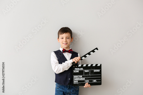 Little boy with clapperboar...
