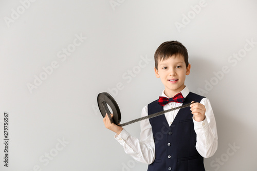 Little boy with film strip ...