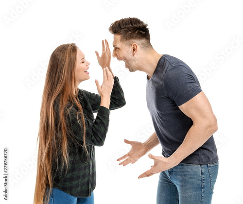 Young quarrelling couple on white background