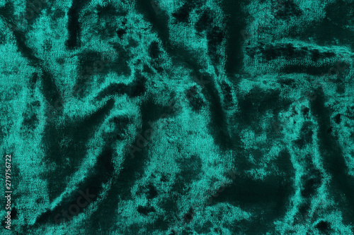 Texture of the fabric velvet emerald green.