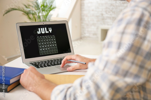 Man working on laptop with ...