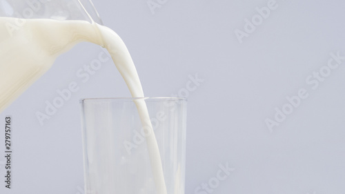 Pouring milk insida a glass