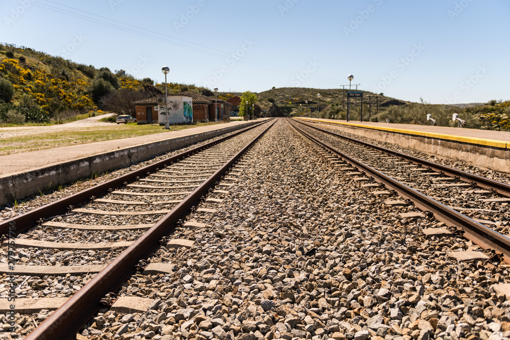 Oxidized railway tracks next to the abandoned Rio Tajo train station, near Garrovillas de Alconetar