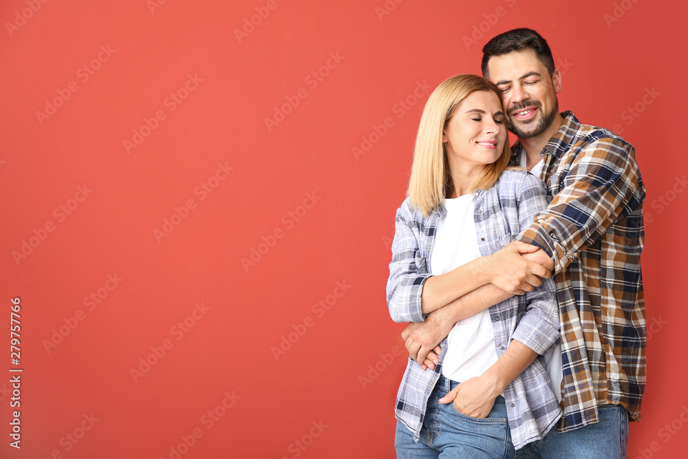 Portrait of happy couple in love on color background