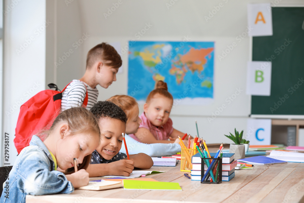 Cute little pupils in classroom Cute little pupils in classroom