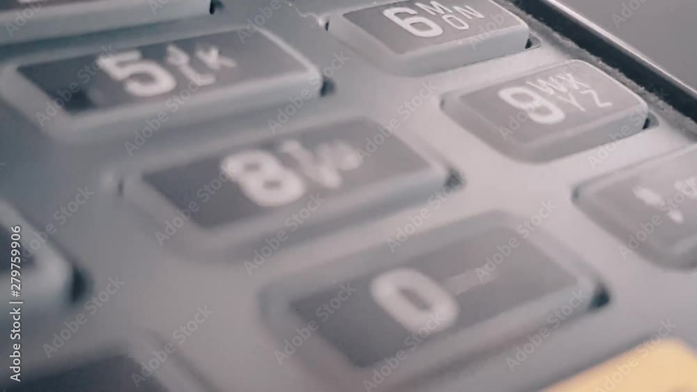 Macro closeup review of the pos terminal and pin pad numbers. Leading to cancel button. Keyboard on black POS terminal. Macro closeup review of the pos terminal and pin pad numbers. Leading to cancel button. Keyboard on black POS terminal.