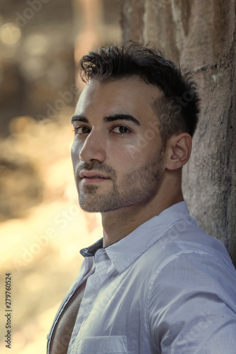 Close-up portrait of handsome young man, outdoor