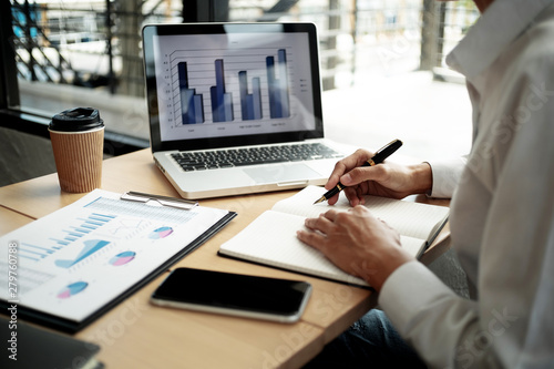 Fotografia Business people working fundamental analyzing about investment in office